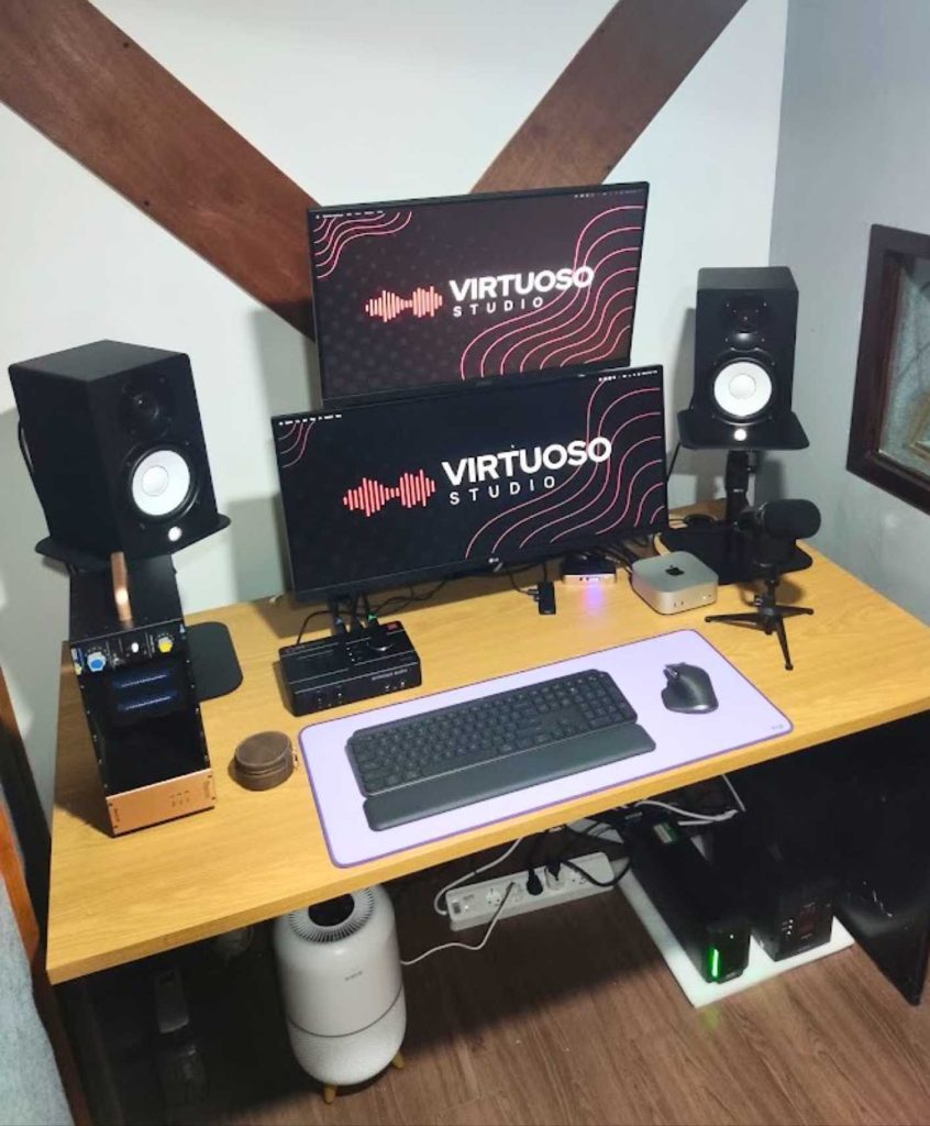 Interior ruang operator Virtuoso Studio menampilkan peralatan profesional seperti audio interface, mixer, speaker monitor, dan layar pengawas proyek dubbing.