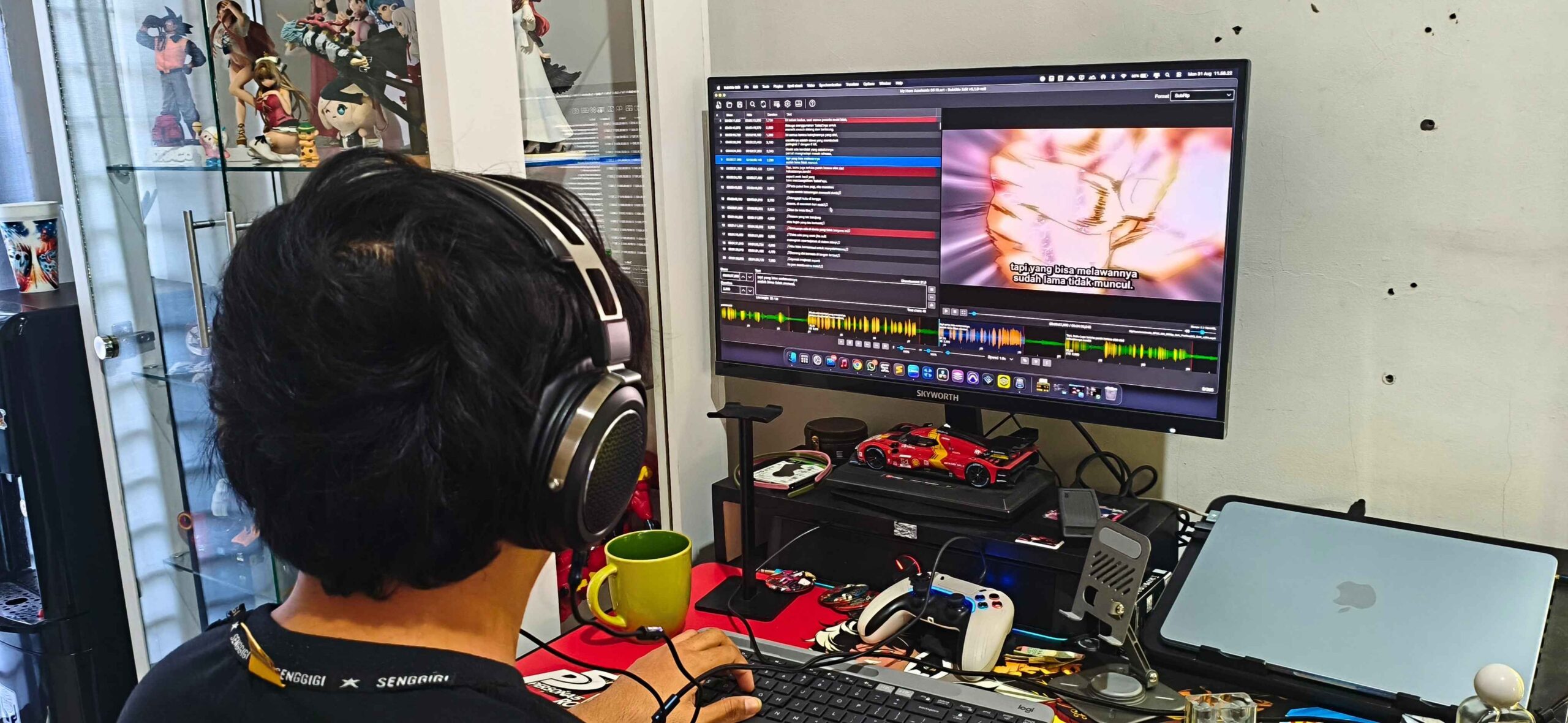 Editor reviewing and timing subtitles for an animated video on a computer.